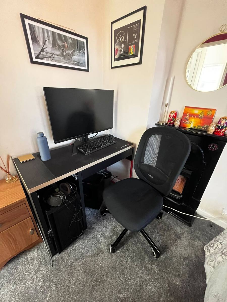 A desk, monitor and office chair ready to be moved