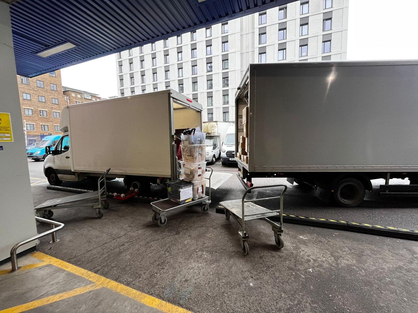 A Fastiya Logistics lorry and Luton van at a London loading bay