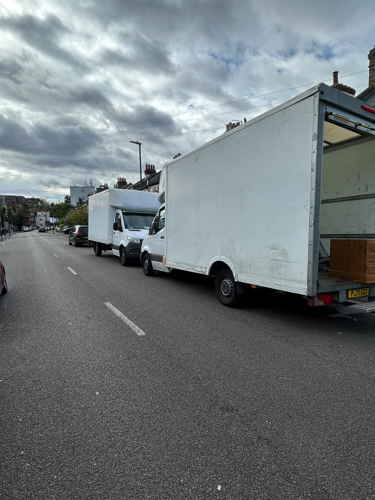 Two Fastiya Logistics Luton vans with tail lifts on a South West London street