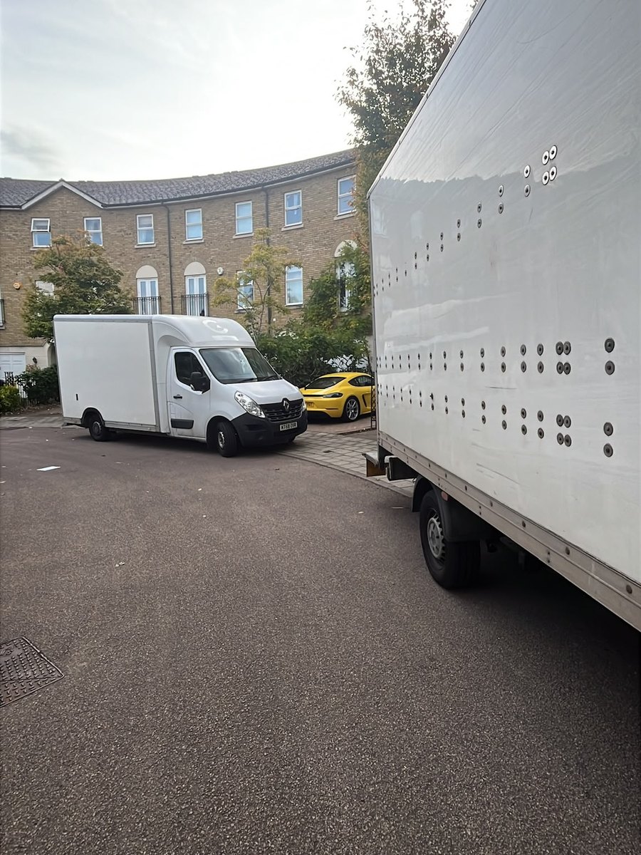 Two Fastiya Logistics vans working the same house move on a residential crescent