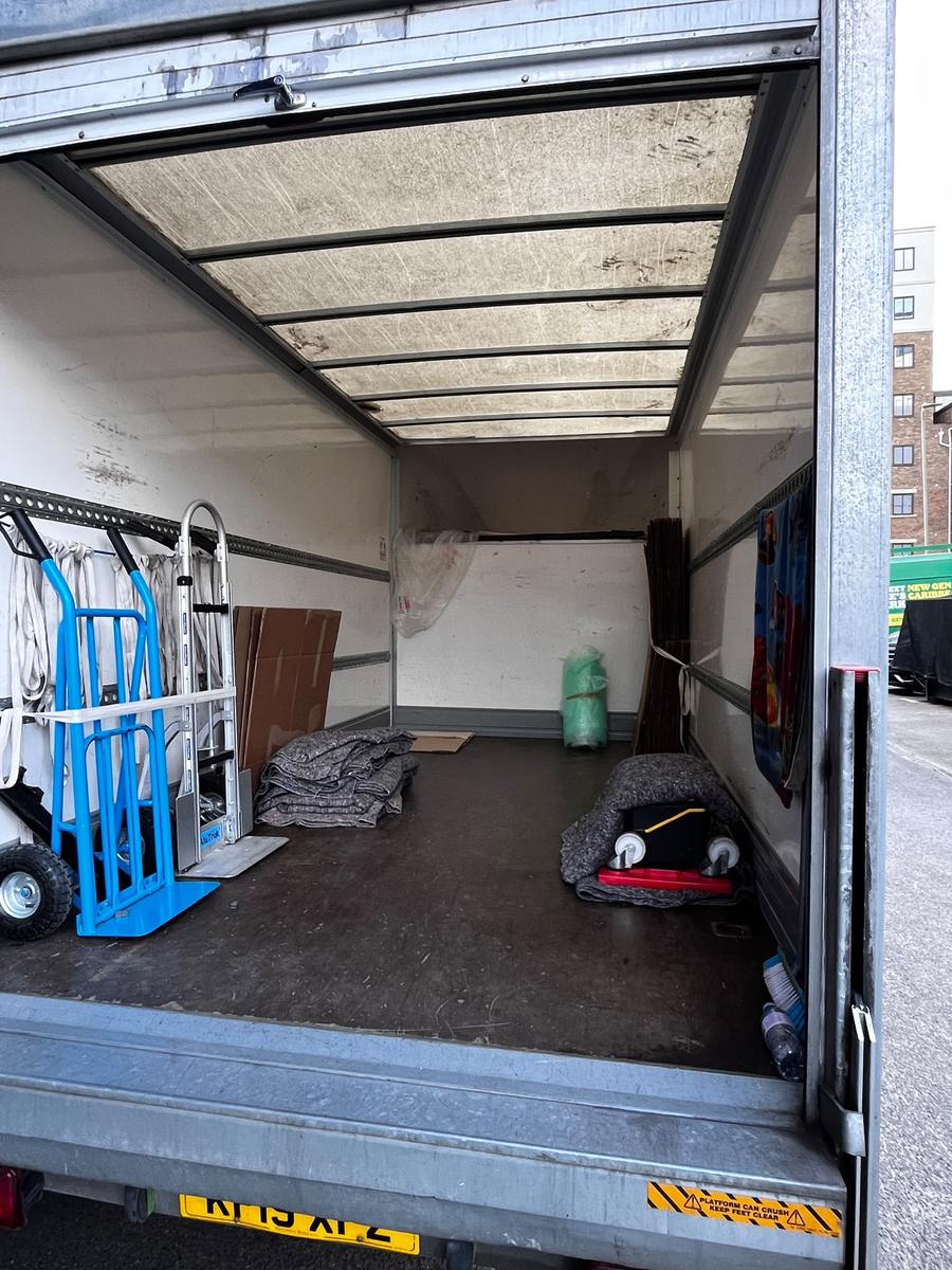 Blankets, straps and trolleys inside a Fastiya Logistics van